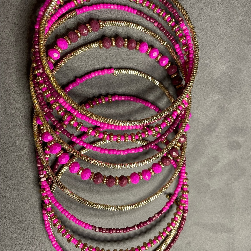 Bracelet with reds pinks maroon’s and some gold